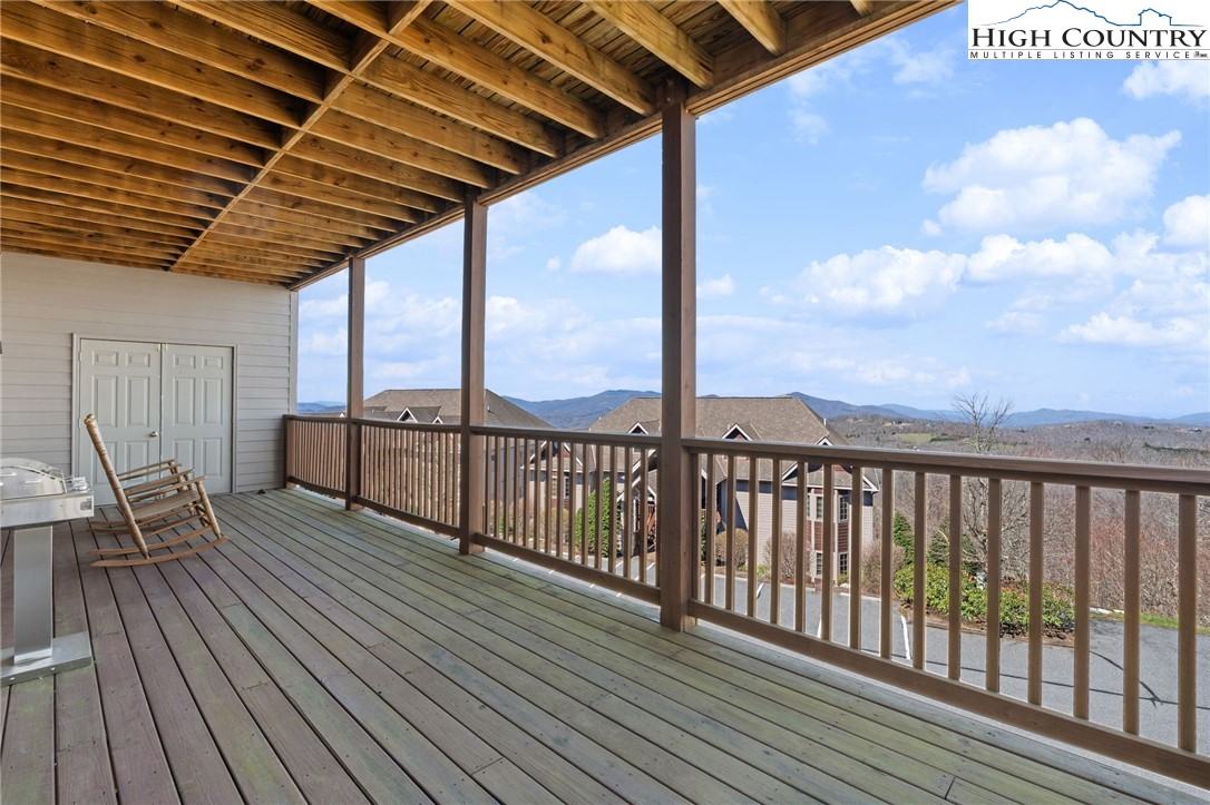 143 Wildflower Ridge, Unit 17D Sugar Mountain, NC 28604 - Photo 27 of 36 a view of a balcony with wooden floor