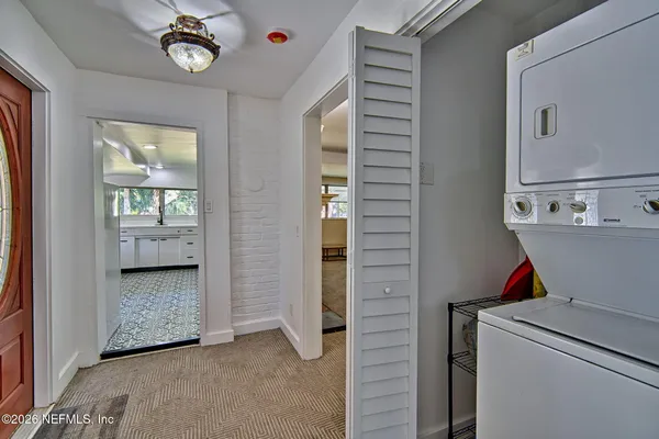 a view of hallway with washer and dryer