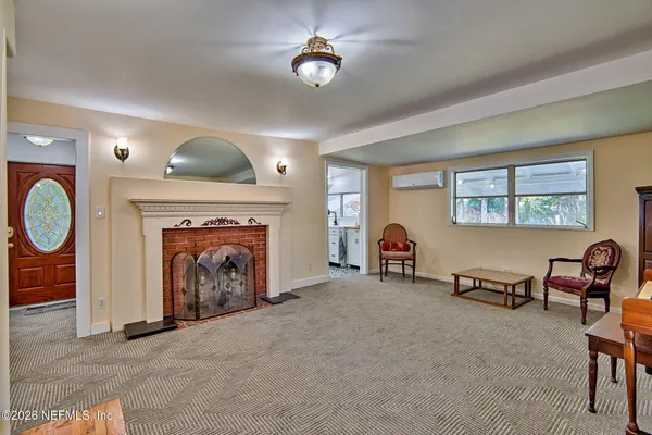 a living room with furniture and a fireplace