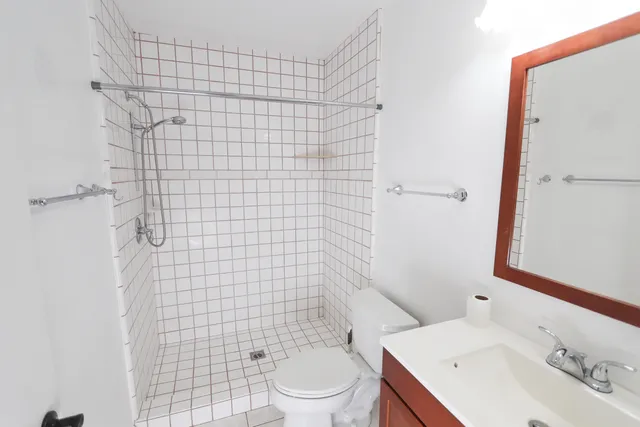 a view of a house with a yard and street