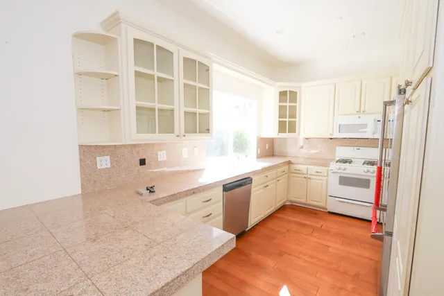 a view of a big room with closet and wooden floor