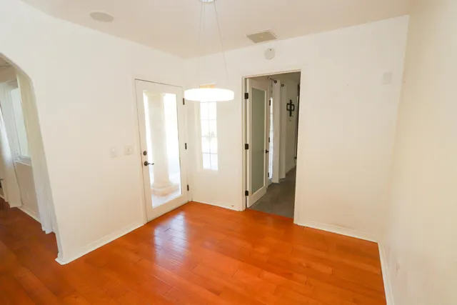 a bathroom with a granite countertop sink a shower and a mirror