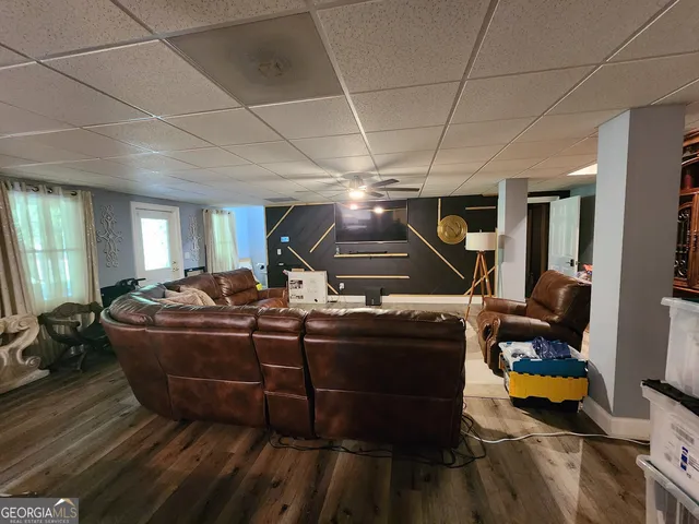 a room with furniture and a wooden floor