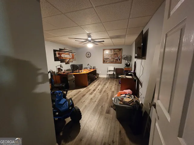 a view of a living room with furniture and a chandelier