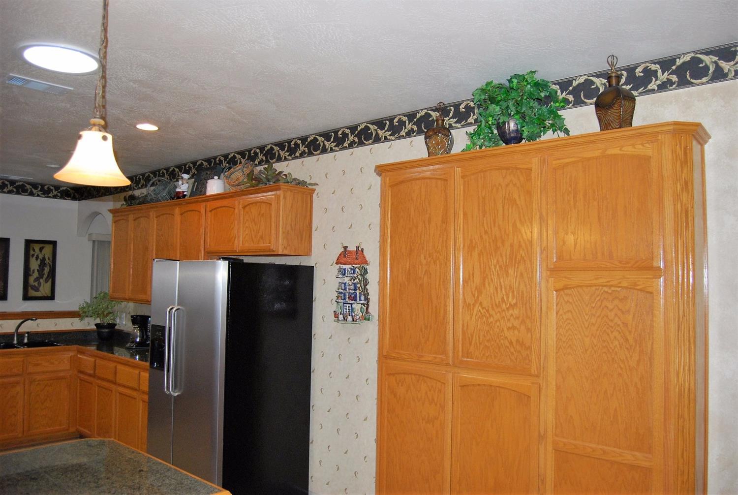 1136 Grouse Ridge Drive Central Point, OR 97502 - Photo 12 of 35 a view of a refrigerator and window
