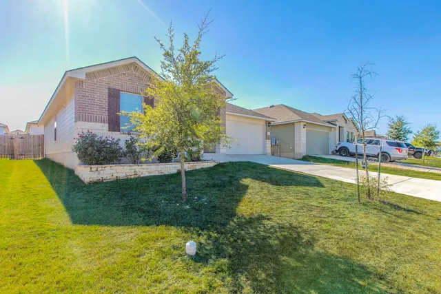 a house with swimming pool in front of it