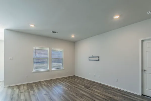 a view of an empty room with a window