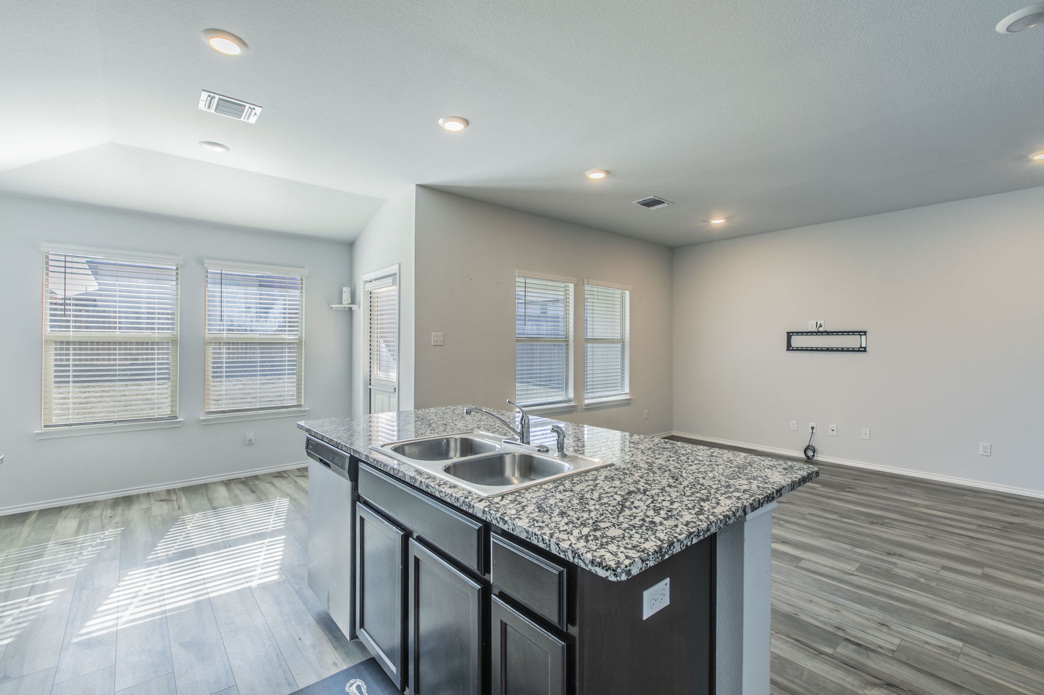 237 Poplin Lane Troy, TX 76579 - Photo 8 of 23 a kitchen with granite countertop sink stove and cabinets
