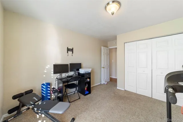 a view of a workspace with furniture