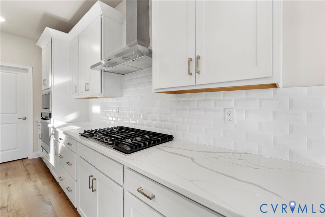 2710 Maidens Road Powhatan, VA 23139 - Photo 15 of 33 a kitchen with white cabinets and a stove