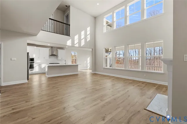 a view of kitchen with furniture and wooden floor