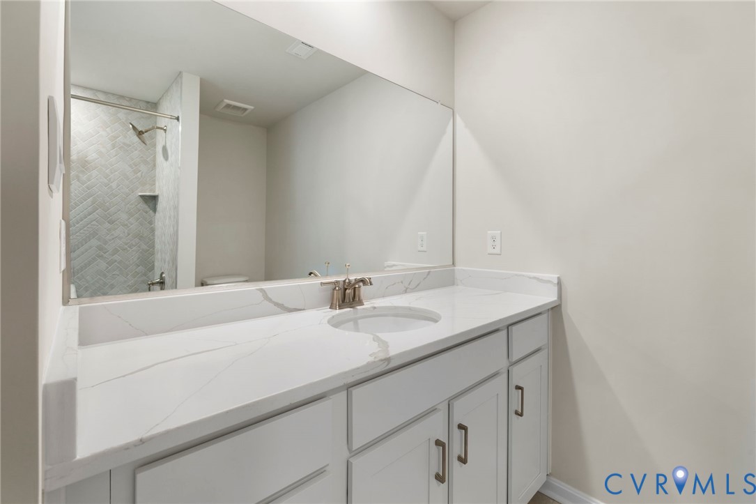 2710 Maidens Road Powhatan, VA 23139 - Photo 27 of 33 a bathroom with a sink and a mirror