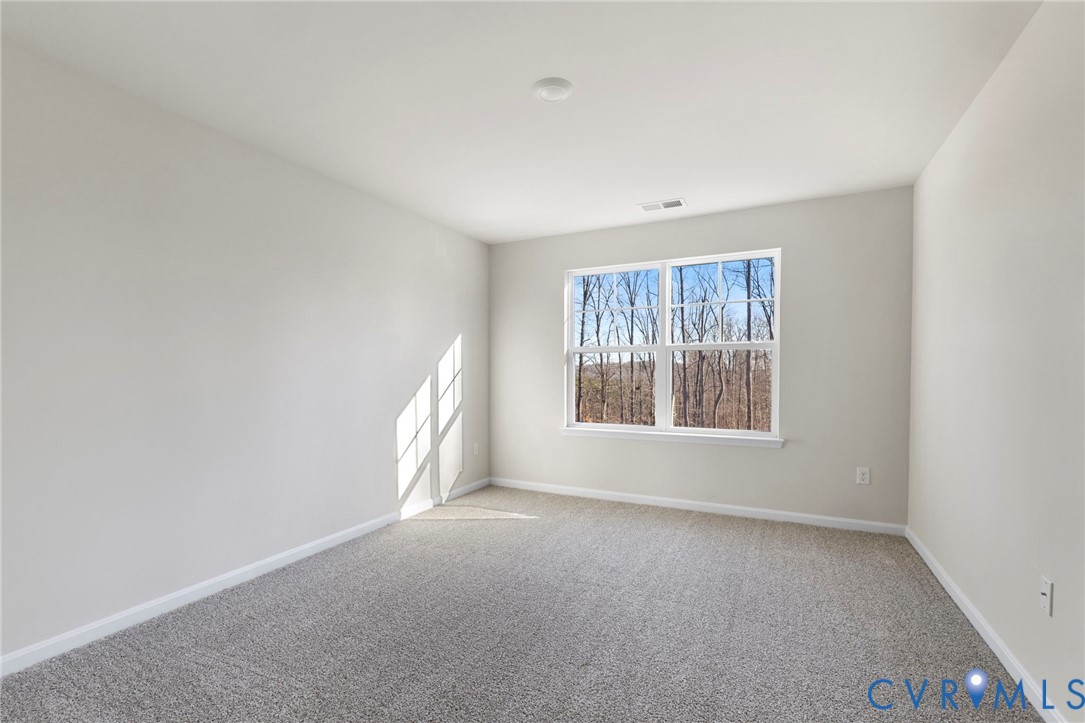 2710 Maidens Road Powhatan, VA 23139 - Photo 31 of 33 a view of a big room with windows and chandelier fan