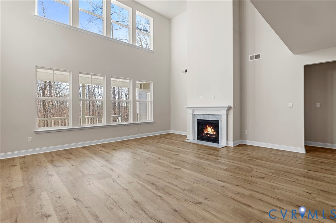 2710 Maidens Road Powhatan, VA 23139 - Photo 8 of 33 a view of an empty room with wooden floor and a window
