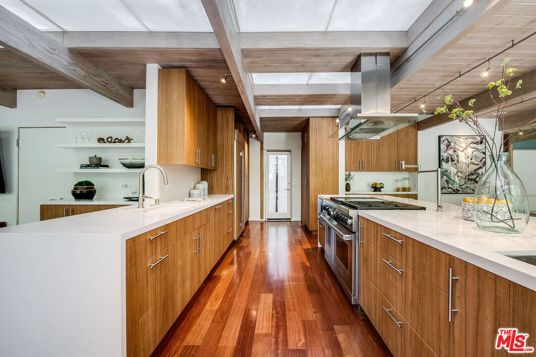 681 Brooktree Road Santa Monica, CA 90402 - Photo 15 of 32 a large kitchen with stainless steel appliances a sink and counter space