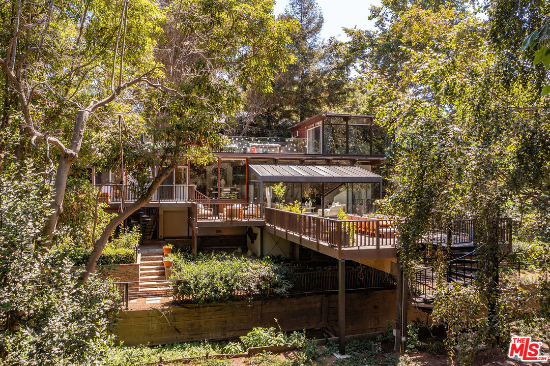 681 Brooktree Road Santa Monica, CA 90402 - Photo 2 of 32 a view of a house with a yard and sitting area