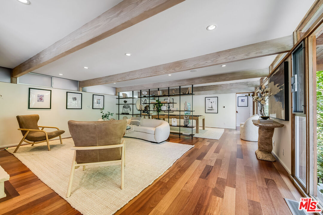 681 Brooktree Road Santa Monica, CA 90402 - Photo 22 of 32 a living room with furniture and a wooden floor