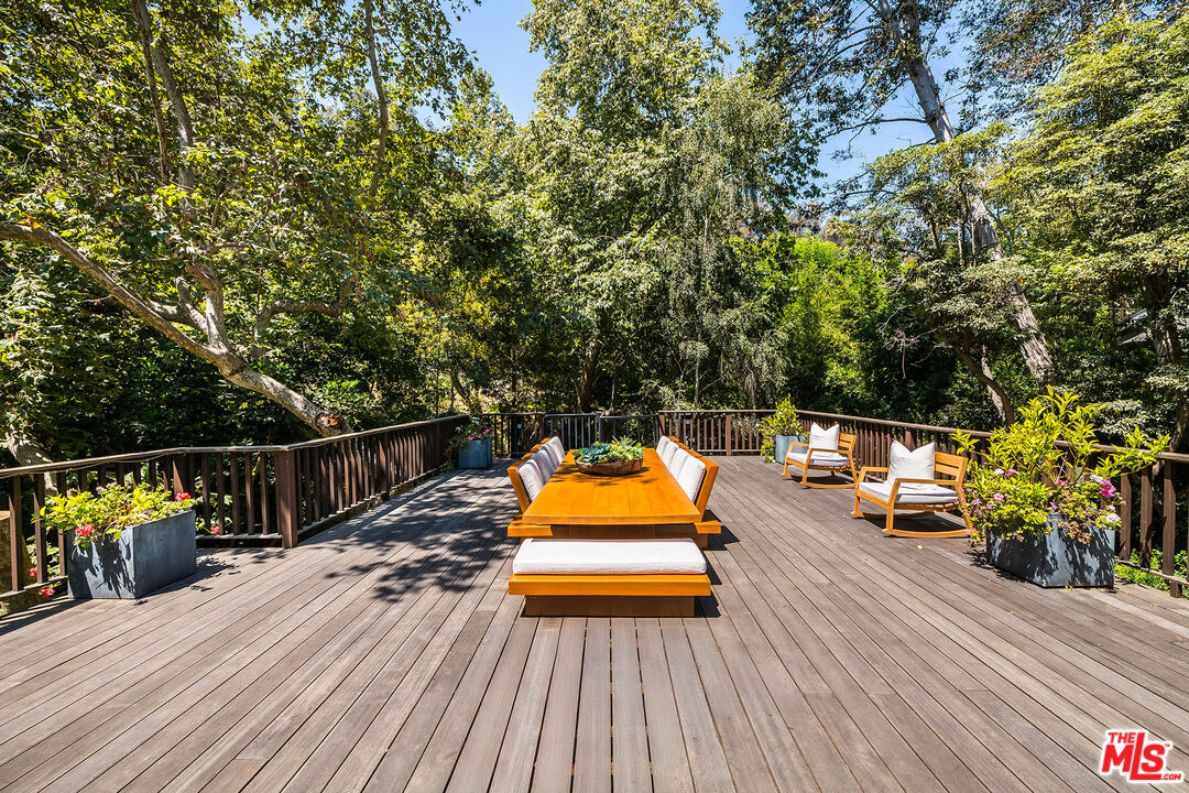 681 Brooktree Road Santa Monica, CA 90402 - Photo 8 of 32 a view of deck with wooden floor and seating space