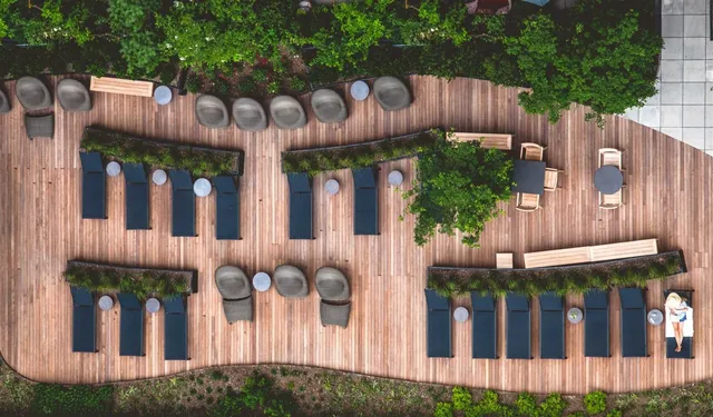 a room with pool table and windows