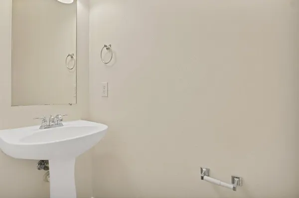a kitchen with granite countertop a stove and a microwave with cabinets