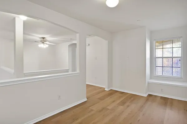 a bathroom with a toilet a sink and a mirror