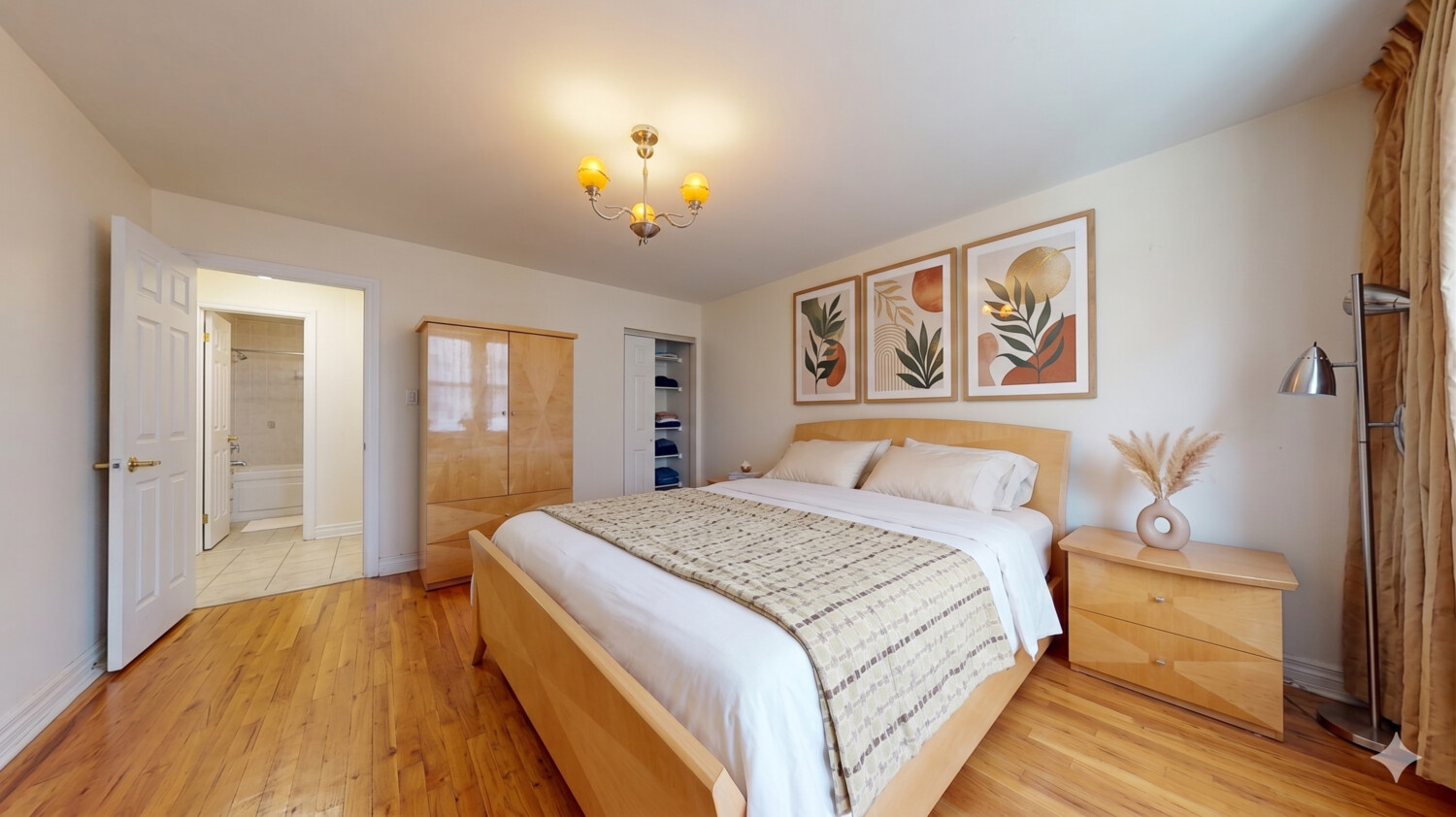 1200 Gravesend Neck Road, Unit 3L Brooklyn, NY 11229 - Photo 3 of 10 a spacious bedroom with a bed and a chandelier