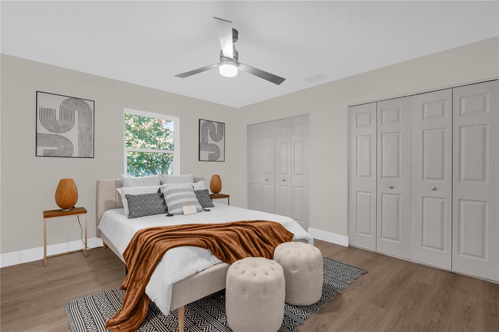 3324 Fox Ridge Drive Winter Haven, FL 33884 - Photo 16 of 28 a bedroom with a bed and window