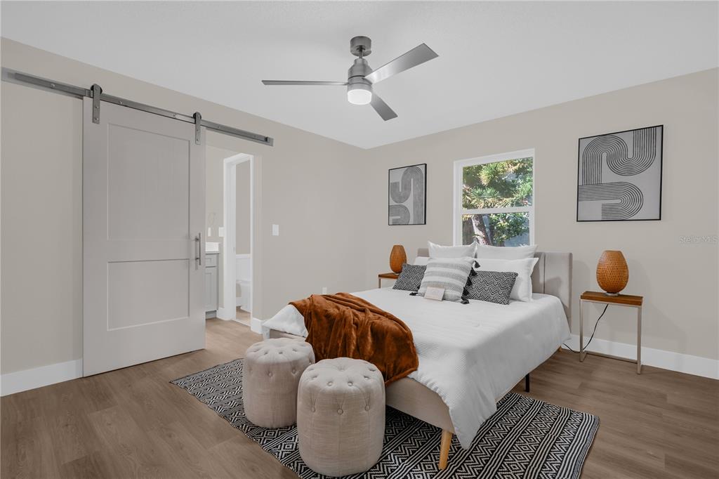 3324 Fox Ridge Drive Winter Haven, FL 33884 - Photo 17 of 28 a bedroom with furniture and a chandelier