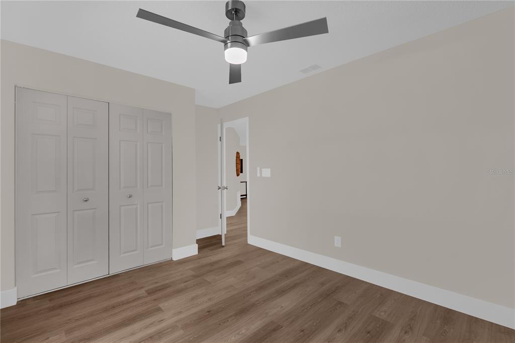 3324 Fox Ridge Drive Winter Haven, FL 33884 - Photo 21 of 28 wooden floor in an empty room