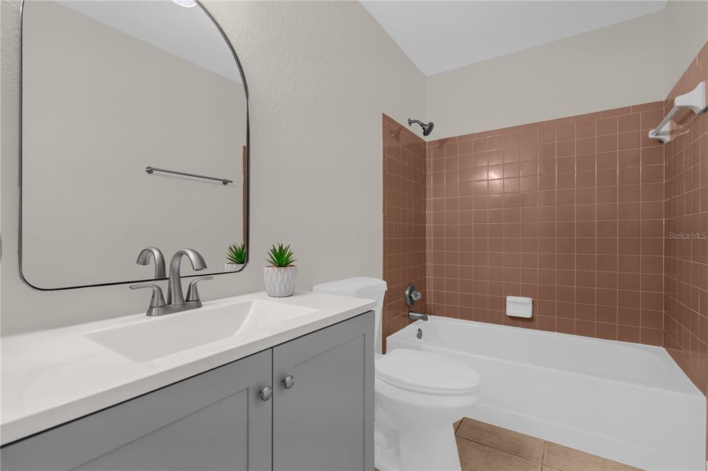 3324 Fox Ridge Drive Winter Haven, FL 33884 - Photo 22 of 28 a bathroom with a sink a toilet and shower