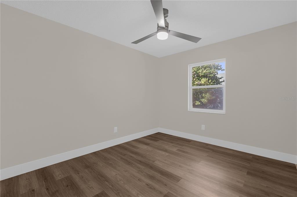 3324 Fox Ridge Drive Winter Haven, FL 33884 - Photo 23 of 28 a view of a room with wooden floor and window