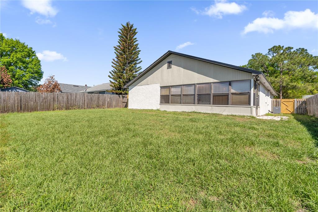 3324 Fox Ridge Drive Winter Haven, FL 33884 - Photo 28 of 28 a view of a house with a yard and garage