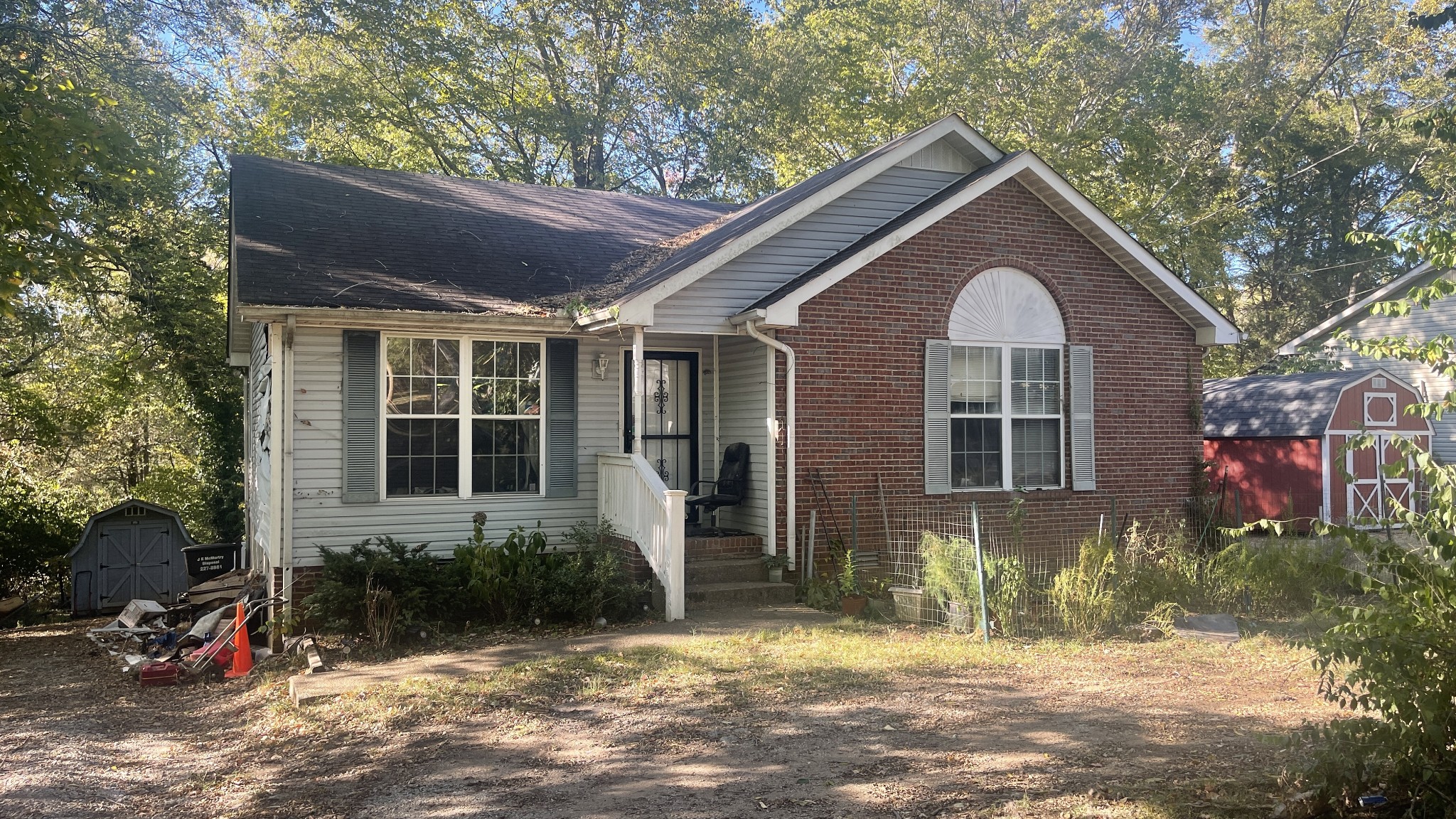 107 Sanitarium Road Madison, TN 37115 - Photo 1 of 23 a front view of a house with a yard