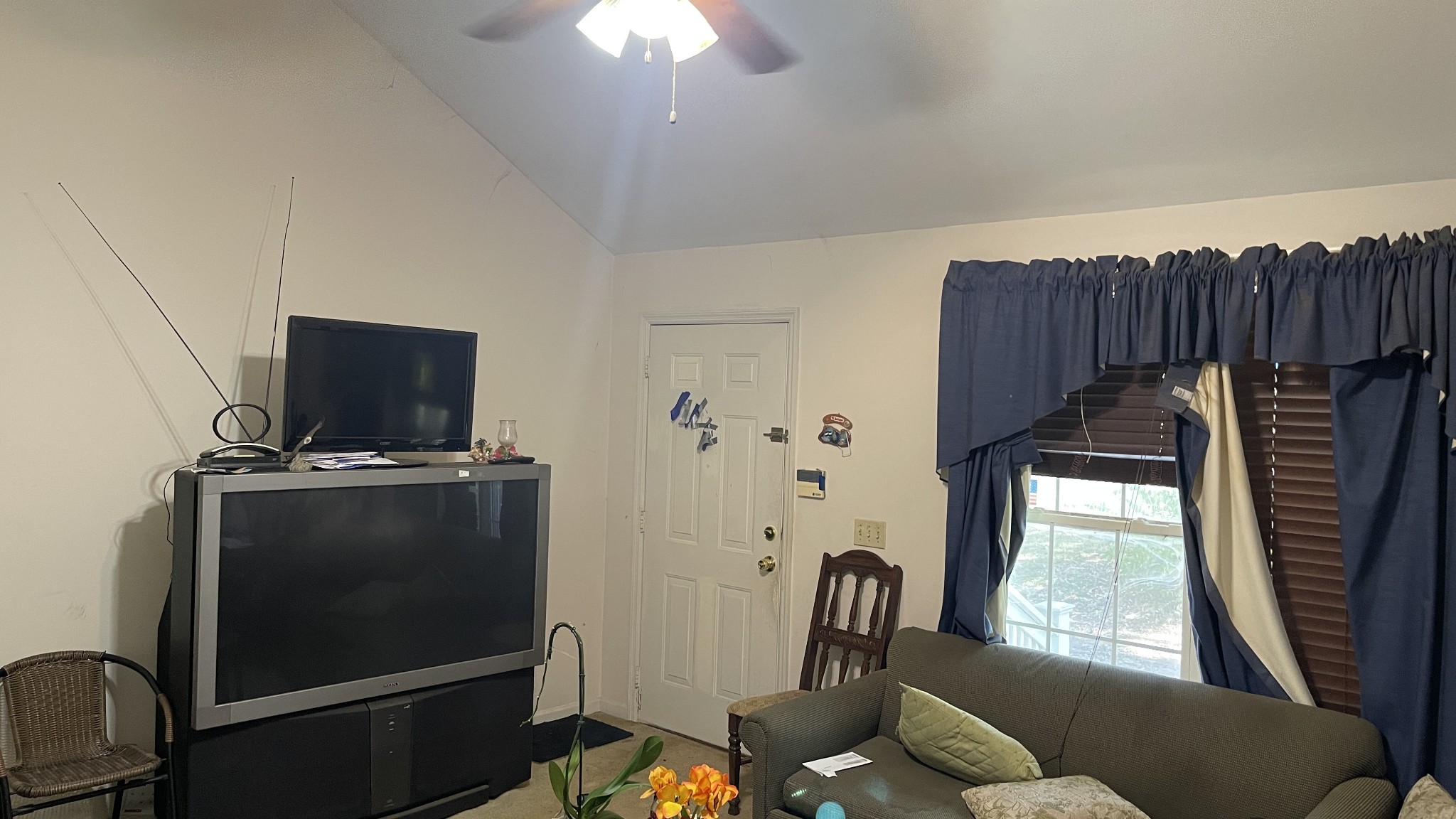 107 Sanitarium Road Madison, TN 37115 - Photo 23 of 23 a living room with furniture and a flat screen tv