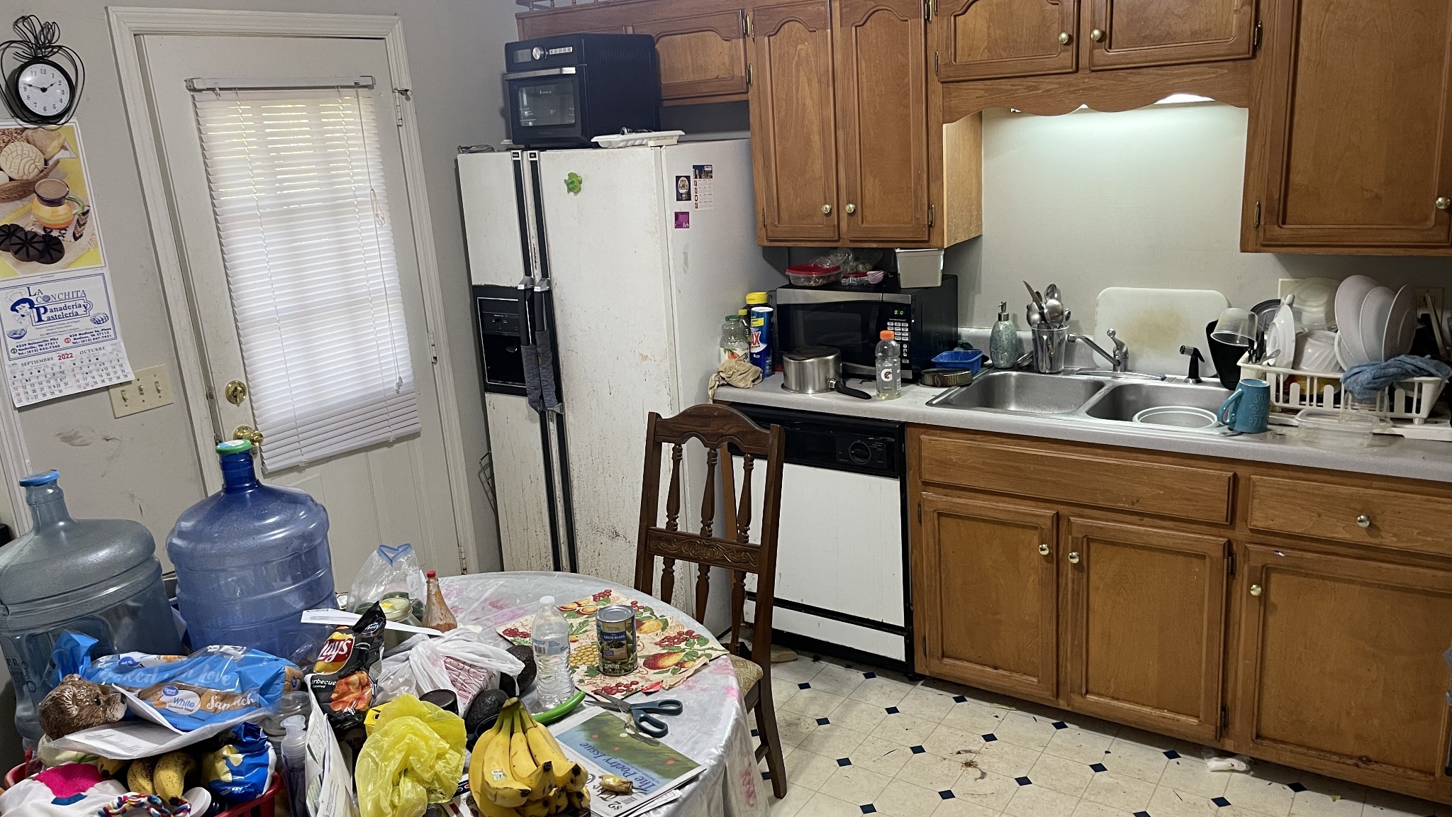 107 Sanitarium Road Madison, TN 37115 - Photo 6 of 23 a kitchen with stainless steel appliances a refrigerator sink and wooden floor