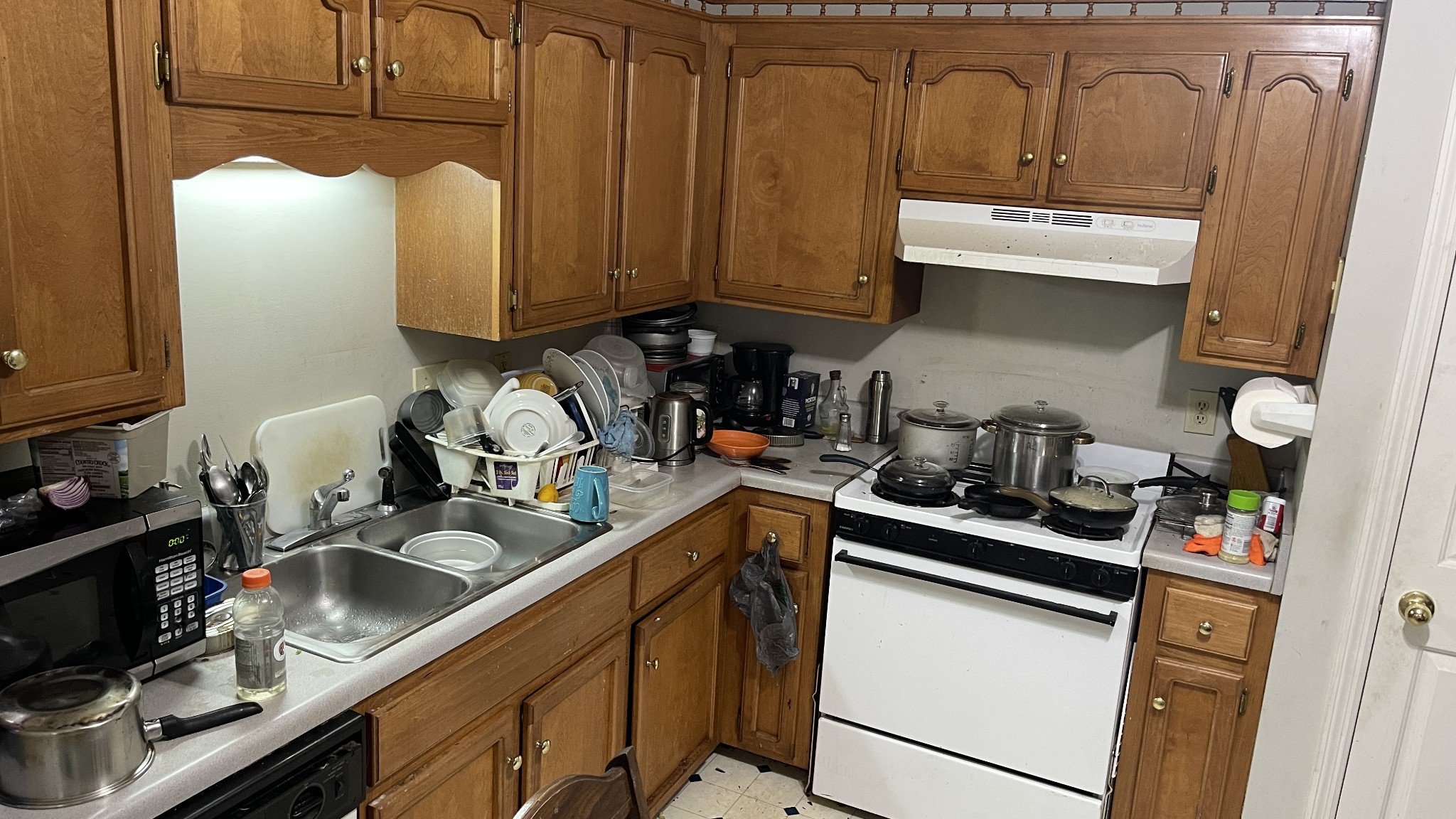 107 Sanitarium Road Madison, TN 37115 - Photo 7 of 23 a kitchen with stainless steel appliances granite countertop a sink a stove and a refrigerator