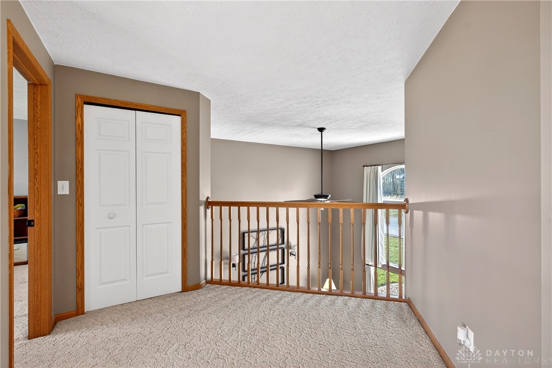 6560 Snyder Road Fletcher, OH 45326 - Photo 44 of 71 This inviting landing features soft carpet, creating a comfortable transition between levels.