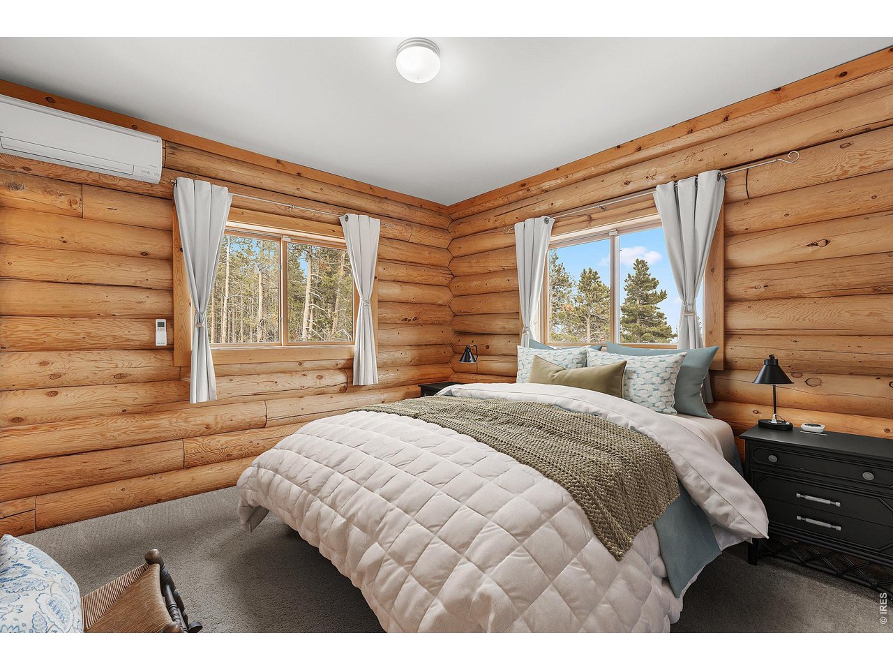 1028 Rudi Lane Golden, CO 80403 - Photo 37 of 46 a bedroom with a bed and a large window