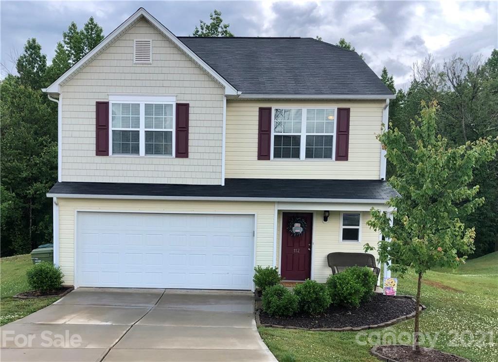 112 York Place Linwood, NC 27299 - Photo 1 of 25 a front view of a house with garden
