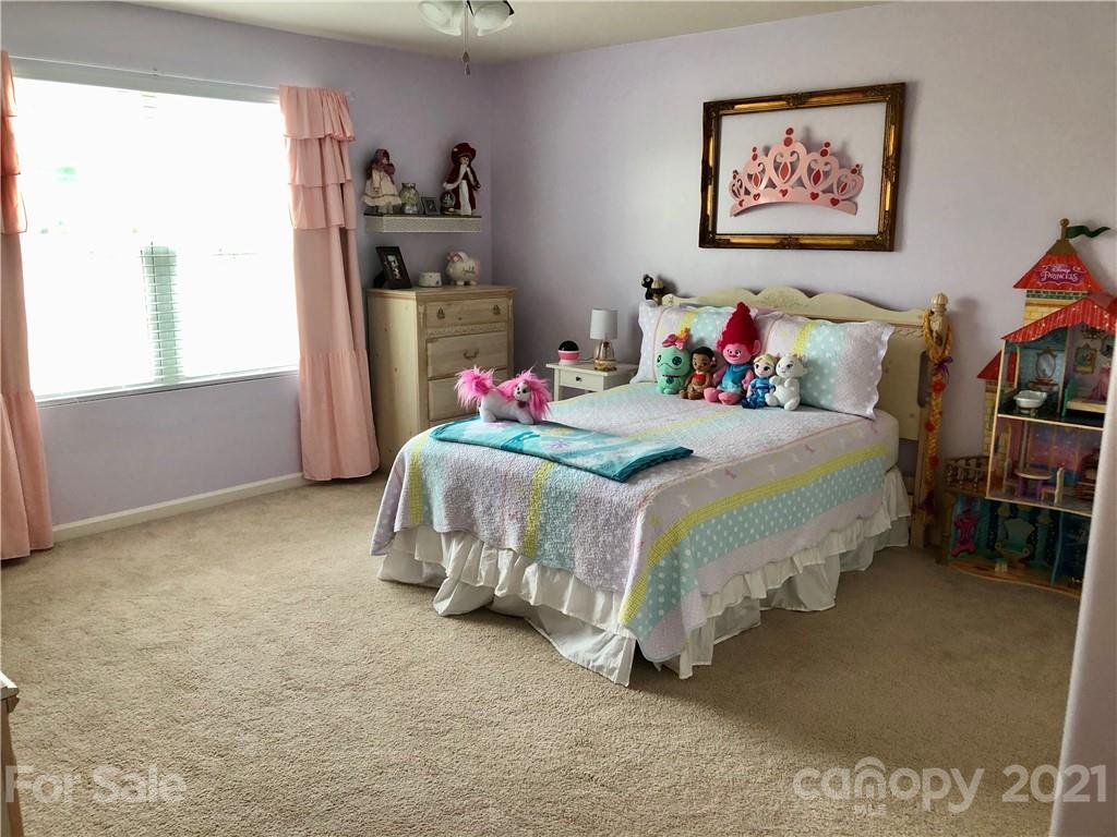 112 York Place Linwood, NC 27299 - Photo 12 of 25 a bedroom with a bed and a cabinets