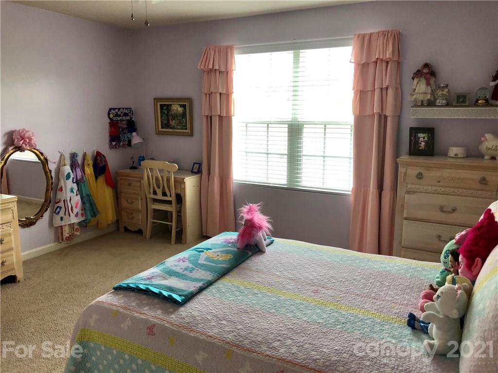 112 York Place Linwood, NC 27299 - Photo 13 of 25 a bedroom with a bed and a window