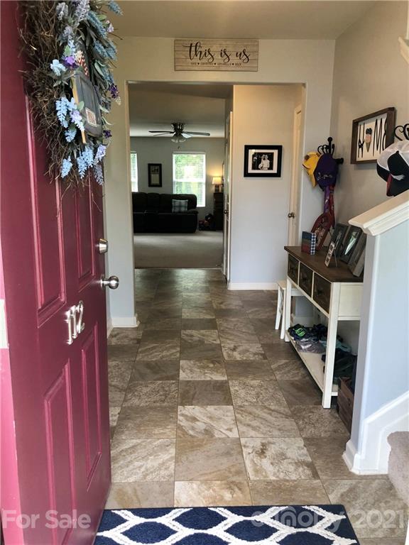 112 York Place Linwood, NC 27299 - Photo 3 of 25 a view of a hallway with a flower pot