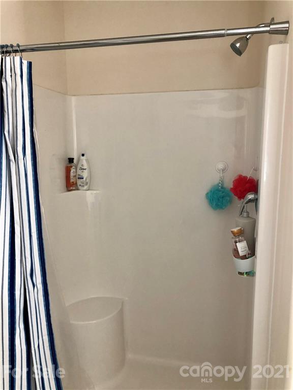 112 York Place Linwood, NC 27299 - Photo 21 of 25 a bathroom with a shower and a sink