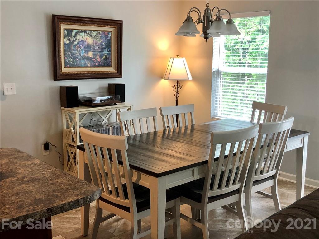 112 York Place Linwood, NC 27299 - Photo 8 of 25 a view of a dining room with furniture window and outside view