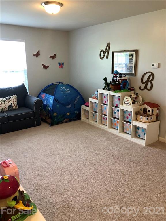 112 York Place Linwood, NC 27299 - Photo 10 of 25 a bedroom with furniture and a window