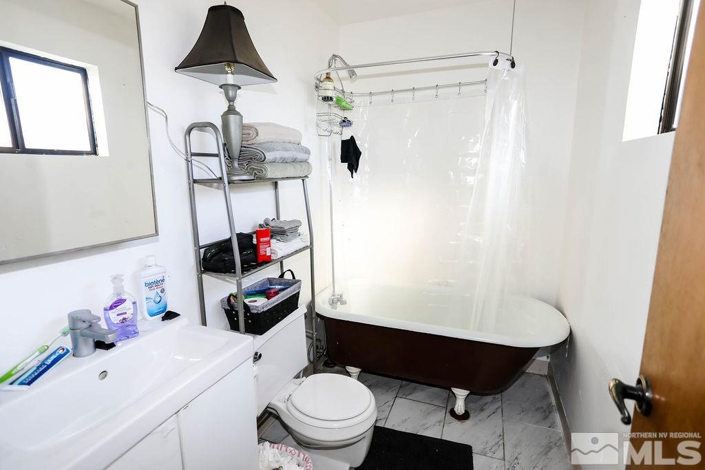 1135 Ralston Street Reno, NV 89503 - Photo 20 of 31 a bathroom with a sink toilet and shower