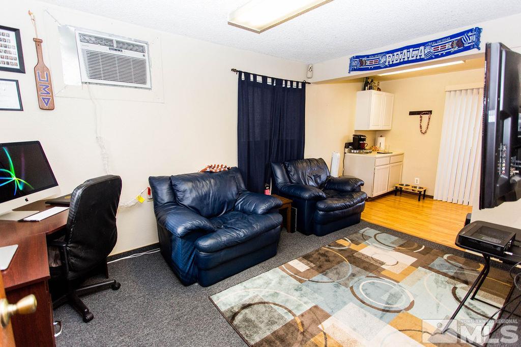 1135 Ralston Street Reno, NV 89503 - Photo 22 of 31 a living room with furniture and a flat screen tv