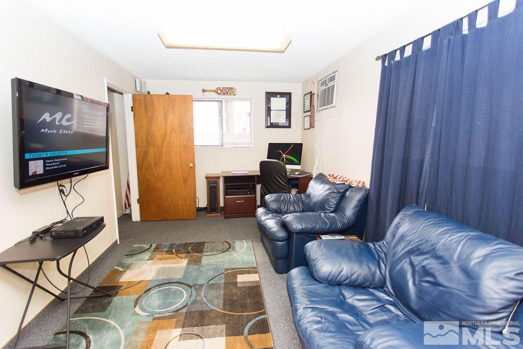 1135 Ralston Street Reno, NV 89503 - Photo 23 of 31 a living room with furniture and a flat screen tv