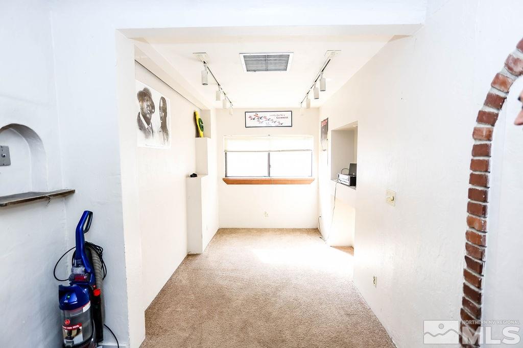 1135 Ralston Street Reno, NV 89503 - Photo 9 of 31 a view of a hallway with paintings on the wall