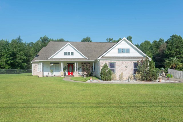 2121 Lee Road Salem, AL 36874 - Photo 1 of 29 a front view of a house with a yard